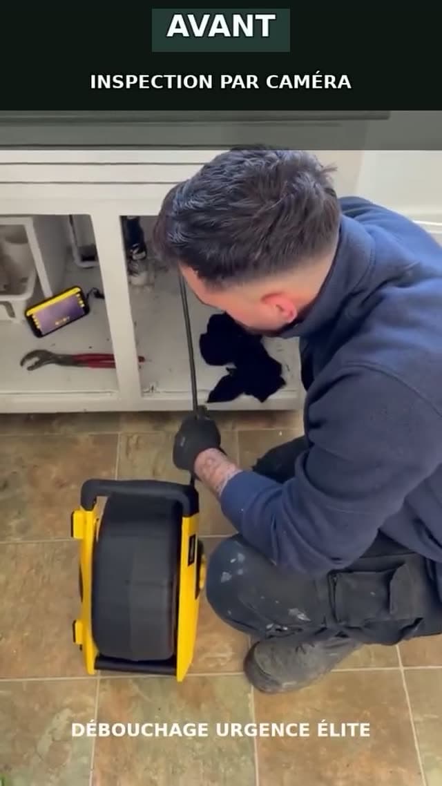 Camera inspection of a drain beneath a bathroom vanity
